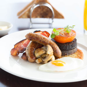 full Scottish breakfast landscape with orange